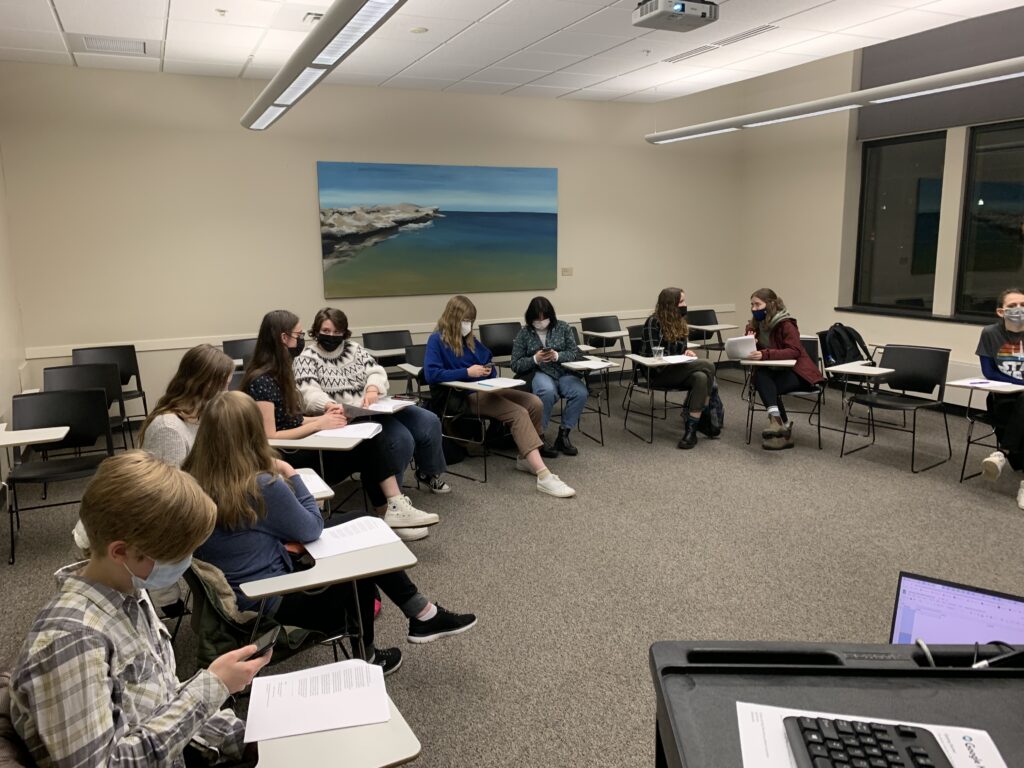 Attend a public meeting and decide what gets published in the magazine! Pictured: Attendees chat before a meeting starts.